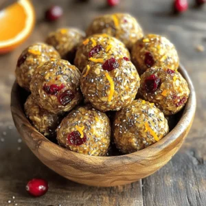 - 1 cup rolled oats - 1/2 cup almond butter (or substitute with peanut butter) - 1/4 cup honey or maple syrup These main ingredients form the base of your energy bites. Rolled oats give them a hearty texture. Almond butter adds healthy fats and a creamy feel. Honey or maple syrup sweetens the bites naturally, making them a treat. - 1/2 cup dried cranberries, finely chopped - 1/4 cup freshly grated orange zest - 1/4 cup chia seeds Now, let's talk about flavor. Dried cranberries add a sweet and tangy burst. They also give a nice chewiness. Freshly grated orange zest brings a bright citrus note. Chia seeds add crunch and boost nutrition. They are rich in fiber and protein. - 1/2 teaspoon ground cinnamon - A pinch of salt Seasonings can elevate your bites. Ground cinnamon adds warmth and depth. Just a pinch of salt balances the sweetness. These simple additions enhance the overall taste and make each bite delightful. Start by gathering your ingredients. In a medium bowl, combine 1 cup of rolled oats, 1/2 cup of almond butter, and 1/4 cup of honey or maple syrup. Use a spatula to mix them until they blend together well. This step creates a strong base for your energy bites. It should feel sticky and hold together. Next, it's time to add in some fun flavors. Mix in 1/2 cup of finely chopped dried cranberries, 1/4 cup of freshly grated orange zest, 1/4 cup of chia seeds, 1/2 teaspoon of ground cinnamon, and a pinch of salt. Stir well to ensure everything is evenly spread throughout the mix. The orange zest gives a bright taste, while the chia seeds add crunch and nutrition. After mixing, cover the bowl with plastic wrap and place it in the fridge for about 30 minutes. This helps the mixture firm up, making it easier to shape. Once chilled, remove the bowl and get ready to roll. With clean hands, scoop out about 1 tablespoon of the mixture and roll it into a ball. Repeat until you shape all the mix into 12 to 15 bites. If you want, roll each bite in coconut flakes or crushed nuts for added texture. Store your energy bites in an airtight container in the fridge, and enjoy them fresh for up to a week. Chilling the mixture is key to great energy bites. It helps the ingredients bind together. When you chill the mixture for about 30 minutes, it firms up nicely. This makes rolling easier and keeps the bites from falling apart. Trust me, skipping this step can lead to a messy experience. For extra flavor and fun, try rolling your bites in coconut flakes or crushed nuts. Both add great texture. Coconut gives a sweet, tropical twist. Crushed nuts add crunch and healthy fats. Choose what you like best! You can even mix both for a colorful, tasty finish. Use a medium-sized mixing bowl to combine the ingredients. A sturdy spatula or wooden spoon works best for mixing. For storage, opt for airtight containers. This keeps your energy bites fresh. Use small containers for easy grabbing when you’re on the go. {{image_4}} If you need a nut-free option, swap almond butter for sunflower seed butter. This change keeps the texture smooth and creamy, just like almond butter. Sunflower seed butter offers a nutty taste that pairs well with cranberries and orange. It’s also a great choice for those with nut allergies. You can adjust the sweetness of your energy bites easily. Instead of honey, try using agave syrup. Agave syrup is sweeter, so you might need less of it. If you prefer, simply reduce the amount of honey used in the recipe. This way, you control how sweet your snacks are, making them just right for your taste. Feel free to get creative with your energy bites! Dried fruits like apricots or raisins can add new flavors. You can also mix in seeds such as pumpkin or sunflower seeds for extra crunch. These add-ins not only enhance the taste but also boost the nutrition of your bites. Experimenting with different fruits and seeds can lead to your perfect snack! To keep your cranberry orange energy bites fresh, store them in an airtight container. This helps prevent moisture and air from spoiling them. You can use glass or plastic containers with tight seals. Always remember to label your container with the date. This way, you’ll know when you made them. These energy bites stay fresh in the refrigerator for up to a week. After that, they may lose their taste and texture. If you notice any changes in smell or appearance, it’s best to throw them out. Always check before snacking! Freezing is a great option for longer storage. To freeze, place the energy bites in a single layer on a baking sheet. Freeze them for about two hours until firm. Then, transfer them to a freezer-safe bag or container. They can last in the freezer for up to three months. When you’re ready to eat, just thaw them in the fridge overnight. Enjoy your tasty snack anytime! These energy bites stay fresh in the refrigerator for up to one week. I suggest placing them in an airtight container to keep them tasty. They maintain their flavor and texture well during this time. If you find that you cannot eat them all, you can also freeze them for longer storage. Absolutely! You can swap ingredients based on your taste. For almond butter, try peanut butter or sunflower seed butter for a nut-free option. Maple syrup is a great choice instead of honey. You can also use any dried fruit, like raisins or apricots, instead of cranberries. These energy bites are packed with health benefits. Rolled oats provide fiber for digestion. Almond butter adds protein and healthy fats. Chia seeds are full of omega-3 fatty acids. Dried cranberries offer antioxidants, while orange zest brings vitamin C to the mix. Together, they create a balanced snack that fuels your day! These energy bites are easy to make and tasty. We mixed oats, almond butter, and honey for a great base. Then, we added fun flavors like cranberries, orange zest, and chia seeds. Don't forget to chill the mixture for the best texture. Use your favorite nut butters or sweeteners for variety. Store them in an airtight container for freshness. Enjoy these bites as a quick snack anytime. Remember, they are not just delicious; they are healthy too.