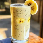 - 1 cup low-fat cottage cheese - 1 ripe banana, sliced - 2 tablespoons natural peanut butter - 1 tablespoon honey (or maple syrup for a vegan option) - 1 cup unsweetened almond milk (or any preferred milk) - 1 tablespoon chia seeds - 1/2 teaspoon vanilla extract - A pinch of salt - Ice cubes (optional, for added thickness) 1. Cottage Cheese: 1 cup provides a creamy base and protein. 2. Banana: 1 ripe banana adds natural sweetness and texture. 3. Peanut Butter: 2 tablespoons give flavor and healthy fats. 4. Honey or Maple Syrup: 1 tablespoon sweetens the mix. 5. Almond Milk: 1 cup helps blend the ingredients. 6. Chia Seeds: 1 tablespoon adds fiber and omega-3s. 7. Vanilla Extract: 1/2 teaspoon enhances the flavor. 8. Salt: A pinch balances the sweetness. 9. Ice Cubes: Optional for thickness and chill. This smoothie packs a protein punch! - Cottage Cheese: 1 cup offers about 28 grams of protein. - Peanut Butter: 2 tablespoons add around 8 grams of protein. - Chia Seeds: 1 tablespoon gives about 2 grams of protein. In total, you can enjoy approximately 38 grams of protein in one serving. This makes it ideal for muscle recovery or a filling snack. Plus, it’s rich in vitamins and minerals that support your health. Start by gathering all your ingredients. You need low-fat cottage cheese, a ripe banana, natural peanut butter, honey, almond milk, chia seeds, vanilla extract, salt, and ice cubes if you want a thicker smoothie. Begin by adding the cottage cheese and sliced banana into your blender. This creamy base is key for a smooth texture. Next, add the peanut butter for that rich flavor. Spoon in the honey or maple syrup to sweeten your smoothie. Pour in the almond milk to help blend everything smoothly. Sprinkle in chia seeds for added nutrition, and don’t forget the vanilla extract for a nice touch. Finally, add a pinch of salt to bring out the sweetness. Now, it’s time to blend! Start your blender on low to mix the ingredients. Gradually increase to high speed. This helps break down any lumps quickly. Blend for about 30 to 60 seconds. The goal is to achieve a creamy, lump-free texture. If you notice it’s too thick, add a little more almond milk and blend again. After blending, taste your smoothie. If you want it sweeter, add more honey or maple syrup. Blend again for a few seconds to mix it well. If you like a thicker smoothie, toss in a few ice cubes before blending one last time. Once it’s just right, pour it into a tall glass. You can garnish it with chia seeds or a banana slice for a nice look. Enjoy! To get a smooth blend, always add the wet ingredients first. Start with the cottage cheese and almond milk. This helps the blades move freely. Next, add the banana and peanut butter. If you want it creamier, blend longer. Use a high-speed setting to avoid lumps. You can mix things up easily. Try adding frozen berries for a fruity twist. Spinach adds green goodness without changing the taste much. Want more protein? Use Greek yogurt or your favorite protein powder. You can even swap the peanut butter for almond butter for a new flavor. Presentation matters! Pour your smoothie into a tall glass. Top it with a sprinkle of chia seeds for crunch. Add a banana slice on the rim for a pop of color. A colorful straw makes it fun. Serve with a smile, and enjoy your tasty creation! {{image_4}} If you want a vegan option, swap honey for maple syrup. Maple syrup adds a sweet touch and keeps it plant-based. Use dairy-free milk like almond or oat milk instead of regular milk. This keeps your smoothie creamy without dairy. You can boost the protein even more! Try adding a scoop of protein powder. This works well with all flavors. Greek yogurt is another great choice. It adds creaminess and extra protein, making your smoothie even richer. Seasonal fruits can change your smoothie game. In summer, add fresh berries for a sweet burst. Raspberries and strawberries mix well with peanut butter. In fall, toss in some spinach for a healthy green touch. It blends in easily and adds nutrients without changing the taste. If you have leftover smoothie, pour it into a clean, airtight container. Seal it tight and store it in the fridge. It stays fresh for up to 24 hours. Before drinking, give it a good shake to mix everything well again. You can freeze your smoothie for later use. Pour the smoothie into ice cube trays or silicone molds. Once frozen, pop the cubes into a freezer bag. They can last for about three months. When you want to enjoy it, blend the cubes with a little milk to get a smooth drink. Keep your smoothie fresh by using a few simple tips. Always use fresh ingredients like ripe bananas and good-quality peanut butter. Store the smoothie in glass containers, as they are less reactive than plastic. If you notice any separation, just stir it up before drinking. Enjoy your tasty treat! A High-Protein Peanut Butter Cottage Cheese Smoothie has around 400 calories. This number can change based on the ingredients you use. For example, if you add more honey or different milk, the calorie count may rise. It’s a great choice for a filling snack or meal. Yes, you can make this smoothie ahead of time. It stays fresh in the fridge for up to 24 hours. Just blend the ingredients, then store it in a sealed container. When you’re ready to drink it, give it a good shake or stir. This way, you enjoy a quick and tasty meal. Cottage cheese offers many health benefits in smoothies. It is high in protein, which helps build muscle and keeps you full. It also has calcium, good for strong bones. Plus, it adds a creamy texture without extra fat. This makes your smoothie rich and satisfying. Adding cottage cheese makes your drink both tasty and nutritious. This blog post covered how to create a nutritious high-protein smoothie. We detailed the ingredients and their amounts, then explored preparation and blending techniques. I shared tips for adjusting sweetness and suggested variations for flavor. Lastly, I gave storage tips and answered common questions. Smoothies can fit into many diets and help nourish your body. Now, you can make a tasty, healthy smoothie with confidence! Enjoy experimenting and discovering new flavors.