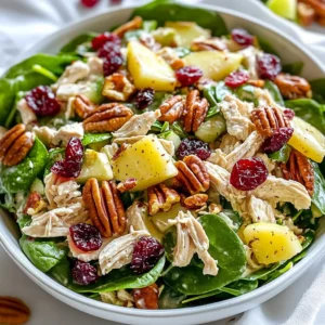 To make a delicious cranberry pecan chicken salad, gather these key items: - 2 cups cooked chicken (shredded or diced) - 1 cup fresh spinach (finely chopped) - &frac12; cup dried cranberries - &frac12; cup pecans (roughly chopped) - &frac12; cup Greek yogurt - 2 tablespoons mayonnaise - 1 tablespoon honey - 1 teaspoon Dijon mustard - &frac14; teaspoon salt - &frac14; teaspoon black pepper - 1 apple (diced, preferably a sweet variety like Honeycrisp) - &frac12; cup celery (finely chopped) You can add these optional ingredients to boost the flavor: - A squeeze of lemon juice for brightness - Sliced green onions for a mild onion flavor - Feta cheese for a salty, creamy touch - A pinch of cayenne pepper for some heat These additions can make your salad even more exciting. When selecting ingredients, keep these tips in mind: - Chicken: Choose fresh, high-quality chicken. Look for organic or free-range options if possible. - Spinach: Pick bright green leaves. Avoid any that look wilted or yellow. - Apples: Go for firm apples with a vibrant color. Honeycrisp adds a great sweetness. - Celery: Look for crisp, bright stalks. They should snap when bent. - Cranberries and Pecans: Check that dried cranberries are plump and not too hard. Choose unsalted pecans for a better flavor balance. These tips will help you create a fresh and tasty salad. {{ingredient_image_2}} To make this yummy salad, start by gathering all your ingredients. In a large mixing bowl, add 2 cups of cooked chicken. You can use shredded or diced chicken, whichever you prefer. Next, toss in 1 cup of finely chopped fresh spinach. Then, add in &frac12; cup of dried cranberries and &frac12; cup of roughly chopped pecans. Mix everything well with a spoon until all the ingredients are combined. In another bowl, whisk together &frac12; cup of Greek yogurt, 2 tablespoons of mayonnaise, 1 tablespoon of honey, and 1 teaspoon of Dijon mustard. Add &frac14; teaspoon of salt and &frac14; teaspoon of black pepper. Keep whisking until the mixture is smooth and creamy. Now, pour this dressing over the chicken mix. Use a spatula to stir gently. Make sure all the ingredients get coated with the dressing. Next, add in 1 diced apple and &frac12; cup of finely chopped celery. Carefully fold these ingredients into the salad. Be gentle so the apple and celery stay crunchy. After mixing, taste the salad. If you want more flavor, add more salt or black pepper to your liking. Finally, cover the salad with plastic wrap or put it in an airtight container. Refrigerate for at least 30 minutes before serving. This waiting time allows the flavors to meld together nicely. When mixing ingredients, be gentle. Use a spatula to avoid crushing the apple and celery. This keeps their texture. If you want a creamier salad, you can add more Greek yogurt. For crunch, add more pecans or celery. Taste as you go. This will help you find the perfect balance. Adjusting seasoning is easy. Start with the basic amounts in the recipe. After mixing, taste the salad. If it needs a little more salt or pepper, add it. You can also add a squeeze of lemon juice for brightness. If you like sweetness, try adding more honey. Each small change can make a big difference in flavor! When making cranberry pecan chicken salad, planning helps. Start by cooking your chicken ahead of time. You can roast, boil, or grill it. Store the chicken in an airtight container in the fridge. It stays fresh for up to four days. Chop your veggies, like spinach and celery, in advance. Keep them in separate containers. This keeps them crisp. After mixing the salad, let it chill in the fridge. This helps the flavors blend well. If you have leftovers, store them in a sealed container. Enjoy them within three days for the best taste. You can easily adjust this salad for different diets. If you want a lighter option, swap Greek yogurt for low-fat yogurt. For a vegan version, use chickpeas instead of chicken and a vegan yogurt. You can also skip the mayonnaise. Need a nut-free dish? Just leave out the pecans. You can add sunflower seeds for crunch. If you're gluten-free, check your mayo and mustard labels. Most are gluten-free but always confirm. Using the right tools makes cooking easier. A sharp knife helps with chopping. A large mixing bowl is key for combining all your ingredients. I recommend using a whisk for the dressing. It helps blend the yogurt and mayo smoothly. A spatula is useful for folding in delicate ingredients, like apples and celery. Finally, invest in airtight containers for storage. They keep your salad fresh and tasty. Pro Tips Use Rotisserie Chicken: To save time, consider using store-bought rotisserie chicken. It&rsquo;s already cooked and adds great flavor. Fresh Herbs Boost Flavor: Adding fresh herbs like parsley or dill can enhance the flavor profile of the salad, giving it a fresh twist. Texture Matters: For extra crunch, consider adding chopped apples just before serving to maintain their crispiness. Make it Ahead: This salad tastes even better the next day, making it a perfect make-ahead dish for meal prep or gatherings. {{image_4}} You can switch up the ingredients in your Cranberry Pecan Chicken Salad for a fresh take. Try adding: - Grapes: Halved grapes add sweetness and a juicy bite. - Walnuts: If you prefer walnuts, they give a nice crunch. - Feta Cheese: Crumbled feta adds a tangy flavor that complements the cranberries. - Dried Cherries: Swap cranberries for dried cherries for a different sweetness. These simple swaps can make your salad feel brand new. Adjust your salad based on the seasons. In the fall, add roasted butternut squash for warmth and depth. In spring, consider adding fresh herbs like parsley or dill for brightness. Summer is perfect for ripe peaches or berries, which can add a delightful sweetness. Seasonal fruits and veggies can keep your salad exciting year-round. Cranberry Pecan Chicken Salad pairs well with various sides. Here are some ideas: - Crusty Bread: A nice loaf of sourdough or baguette complements the salad well. - Mixed Greens: Serve it over a bed of mixed greens for added crunch and nutrition. - Soup: A light vegetable or chicken soup makes a perfect match for a hearty meal. These pairings can elevate your dining experience and make it more satisfying. Store your leftover chicken salad in an airtight container. This keeps it fresh and tasty. Make sure to cover the container tightly. If you do not have an airtight container, use plastic wrap. The salad will stay better when it is sealed well. Always place it in the fridge right after serving. Enjoy it within three to four days for the best taste. Each ingredient in your chicken salad has a different shelf life. Cooked chicken lasts three to four days in the fridge. Fresh spinach should be used within one week. Dried cranberries can last up to a year if stored in a cool, dry place. Pecans stay fresh for six months if kept in an airtight container. Greek yogurt usually lasts one to three weeks after opening. Always check for any off-smells or changes in texture before using. You can freeze chicken salad, but it may change in texture. If you want to freeze it, pack it tightly in a freezer-safe container. Leave some space at the top for expansion. It is best to eat it within three months. To thaw, place it in the fridge overnight. Avoid thawing at room temperature, as it can grow bacteria. When ready to serve, stir it well to mix the ingredients again. Cranberry Pecan Chicken Salad is packed with nutrients. Each serving has protein from chicken, healthy fats from pecans, and fiber from spinach and apples. This salad offers: - Calories: About 350 per serving - Protein: Around 25 grams - Carbohydrates: Roughly 30 grams - Fats: About 15 grams - Fiber: Approximately 4 grams The dried cranberries add a touch of sweetness, while Greek yogurt keeps it creamy and light. Overall, it is a balanced dish that is both tasty and nutritious. Yes, you can make this salad ahead of time! It keeps well in the fridge. I suggest preparing it a few hours before serving. The flavors blend better when it sits. Just be sure to store it in an airtight container. This way, it stays fresh and tasty. If you want a swap for Greek yogurt, try using sour cream or cottage cheese. Both options give a similar creamy texture. You can also use plain regular yogurt, but it may be a bit thinner. Just adjust the amount of mayo if you prefer a thicker salad. Cranberry Pecan Chicken Salad is easy to make and full of flavor. You need fresh ingredients for the best taste. We covered steps for mixing and customizing the salad to your liking. Remember to store leftovers properly for freshness. This salad fits many diets and can become your go-to recipe. Try different ingredients to find your favorite mix. Enjoy making a dish that's both tasty and healthy!